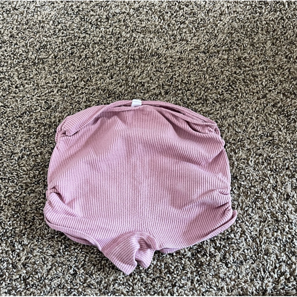 Pink out from under scrunch shorts